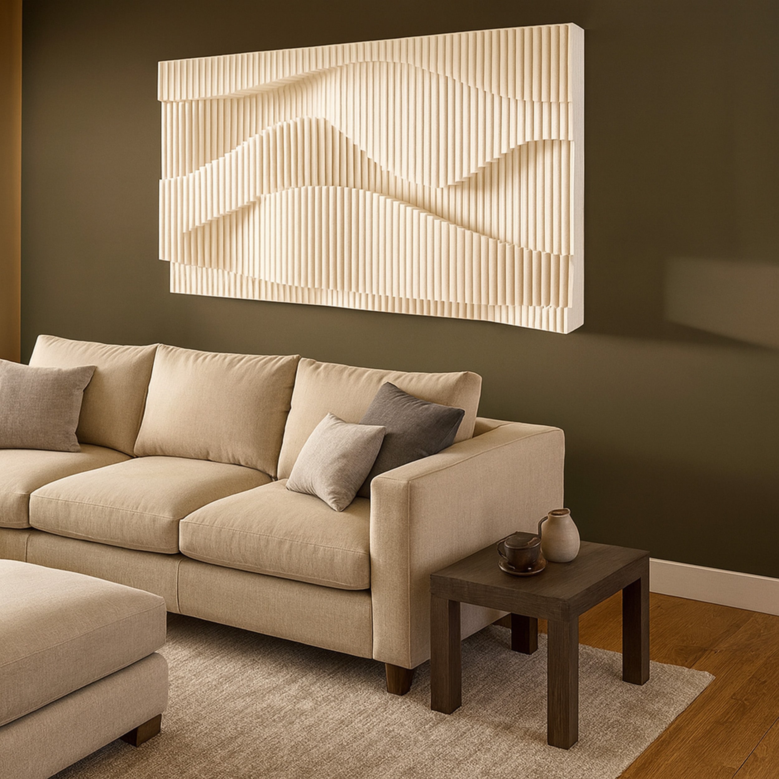 Beige sectional sofa with decorative pillows in a living room setting, featuring a modern wall art piece.
